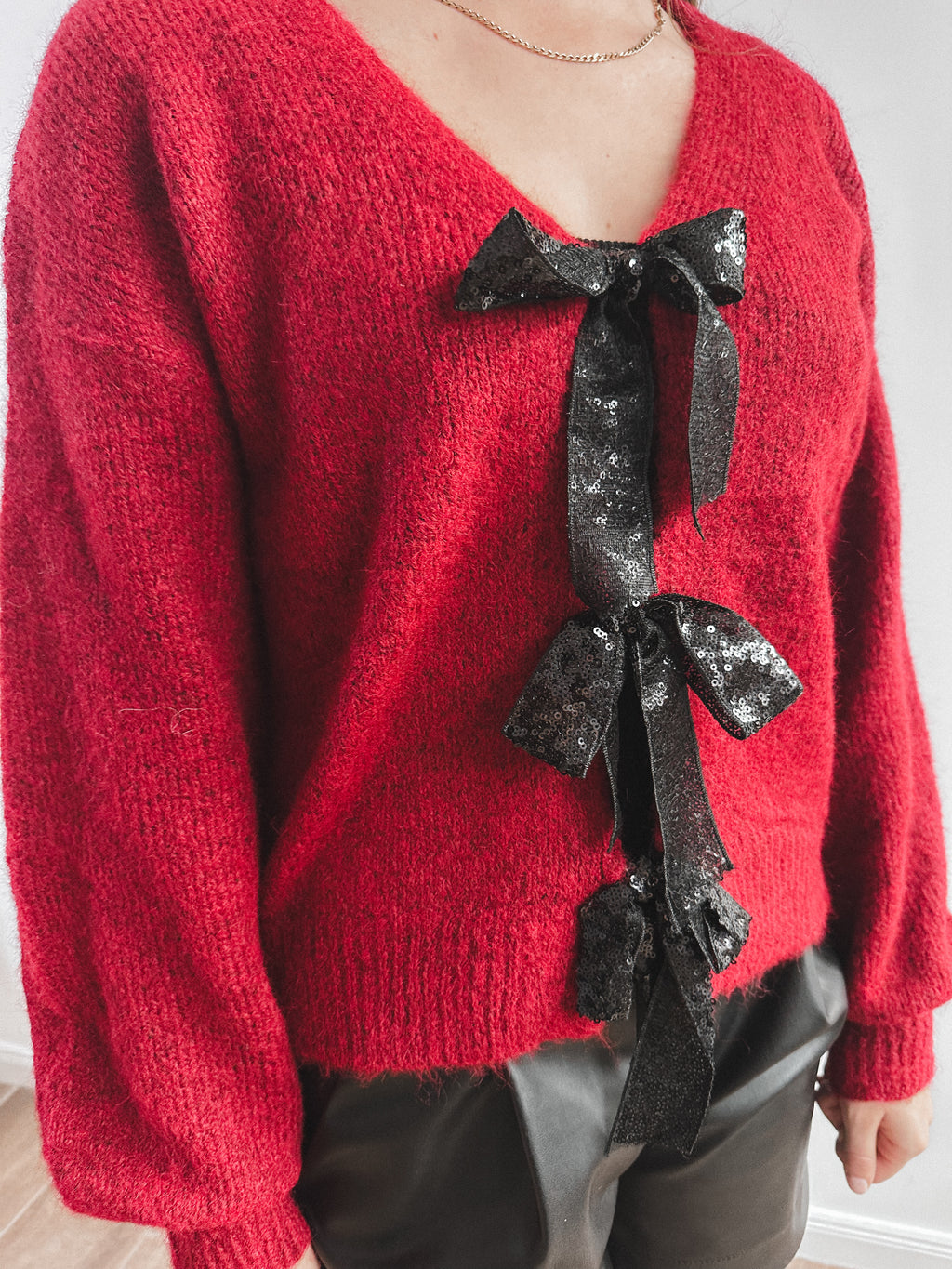 Cardigan mit glitzer Schleife